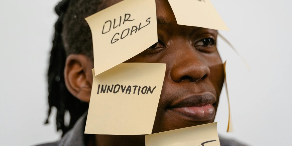 A person deep in thought, brainstorming fresh ideas to create original content and stand out.