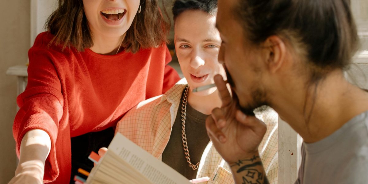 A group of friends enjoying a hearty laugh together, emphasizing the mental health benefits of humor.