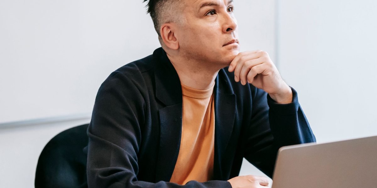 A person looking thoughtfully into the distance, representing longing, hope, and emotional connection.